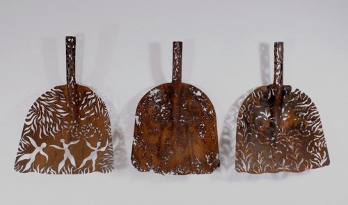 Rusty shovel heads transformed into delicate lace-inspired sculptures
